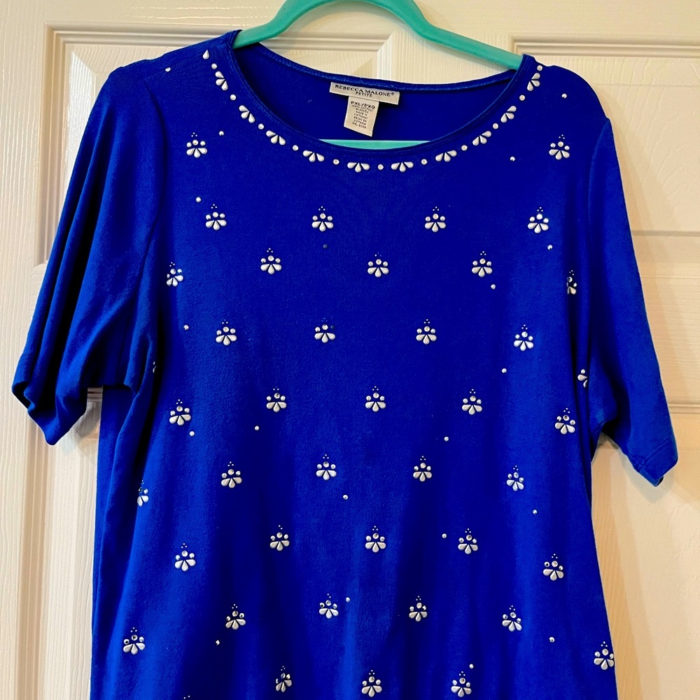 Rebecca Malone blue shirt